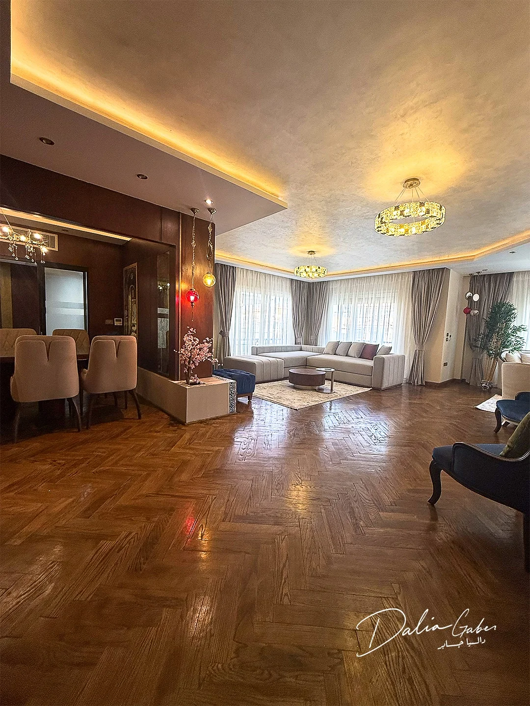 New Cairo reception with parquet flooring, warm lighting and bespoke seating